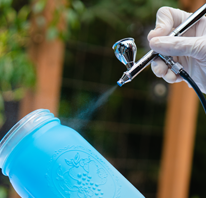 image of airbrushing a mason jar